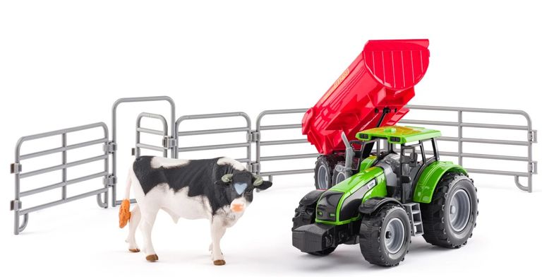 Traktor s přívěsem a býkem se zahradou